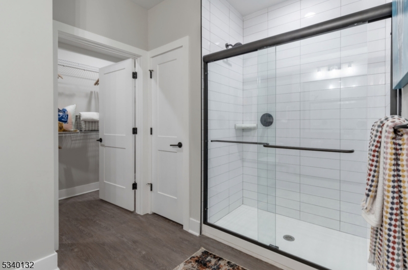 100 Union Street, Unit 429 Elizabeth, NJ 07202 - Photo 30 of 41 a bathroom with a glass shower door