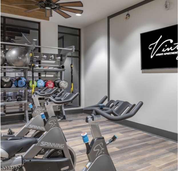 100 Union Street, Unit 429 Elizabeth, NJ 07202 - Photo 7 of 41 a room with gym equipment and a mirror