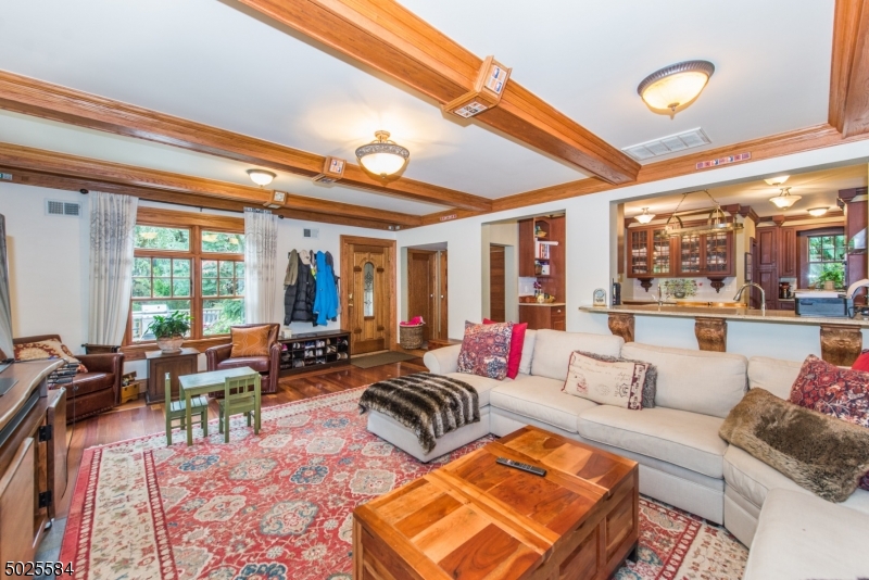 89 Ridgewood Avenue Glen Ridge, NJ 07028 - Photo 12 of 21 a living room with furniture and a large window