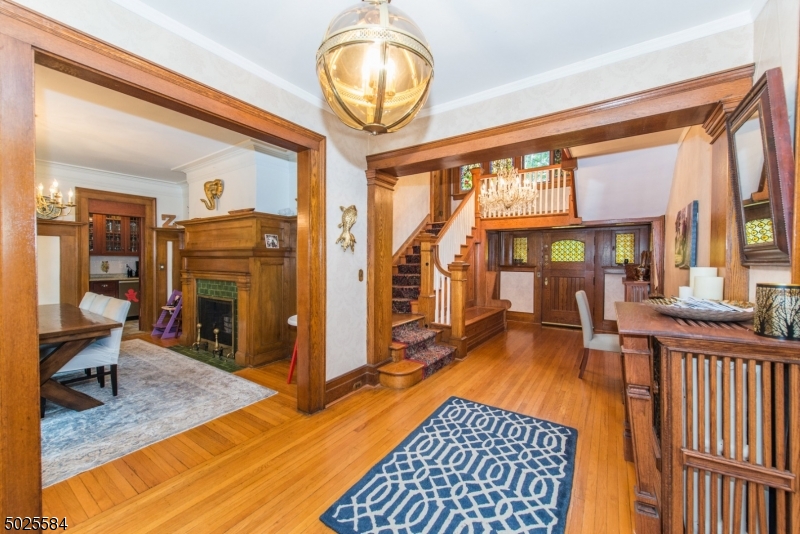 89 Ridgewood Avenue Glen Ridge, NJ 07028 - Photo 4 of 21 a living room with furniture a rug and a large window