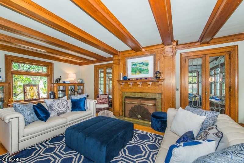 89 Ridgewood Avenue Glen Ridge, NJ 07028 - Photo 5 of 21 a living room with furniture and a fireplace
