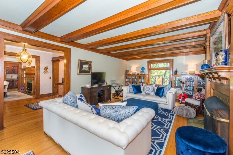 89 Ridgewood Avenue Glen Ridge, NJ 07028 - Photo 6 of 21 a living room with furniture and a flat screen tv
