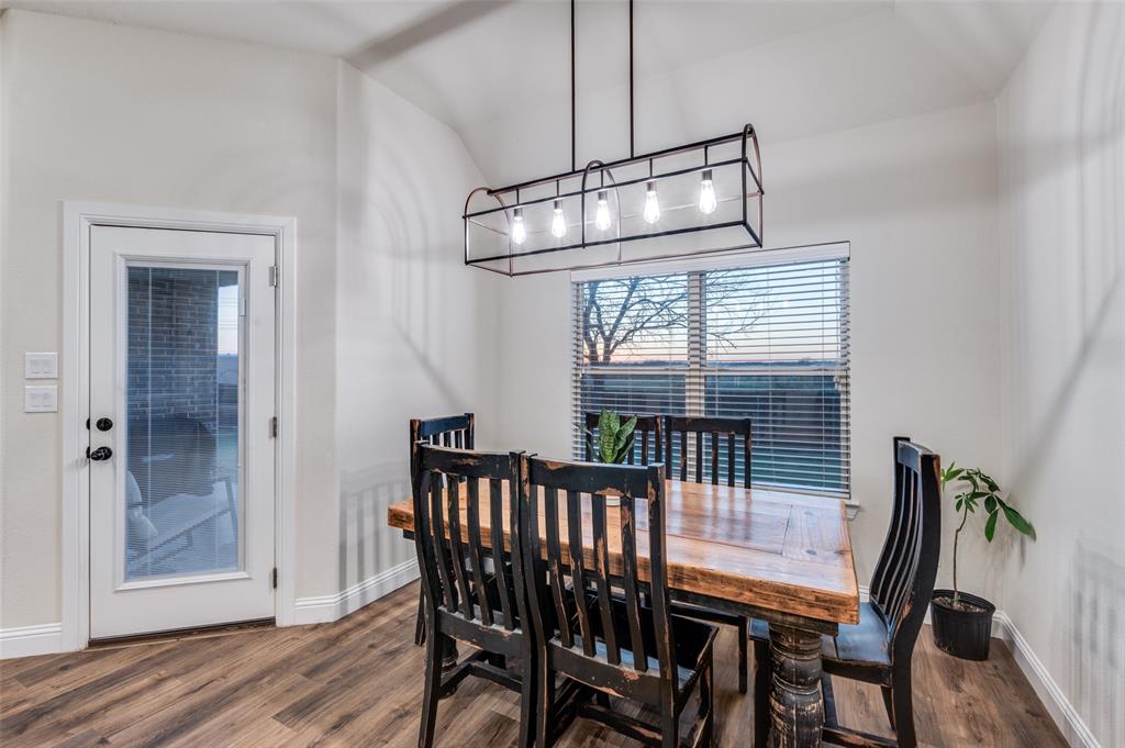331 Osage Court Krum, TX 76249 - Photo 9 of 19 Modern Fixture. Eat-in overlooks sunset.