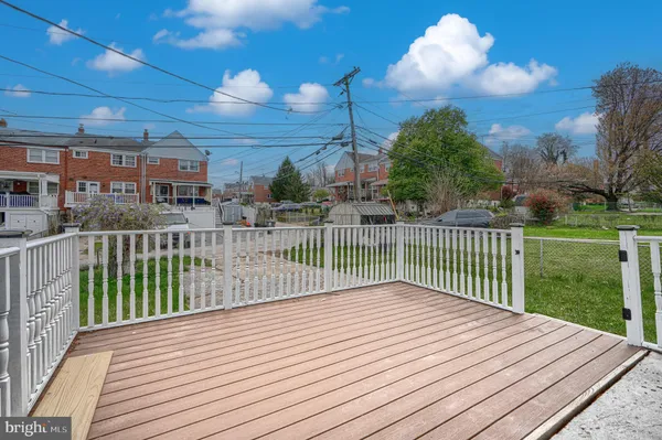 a view of a balcony with wooden floor