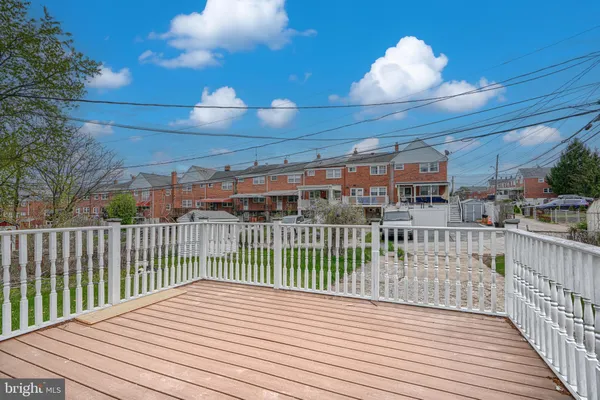 a view of a deck with a yard and a garden