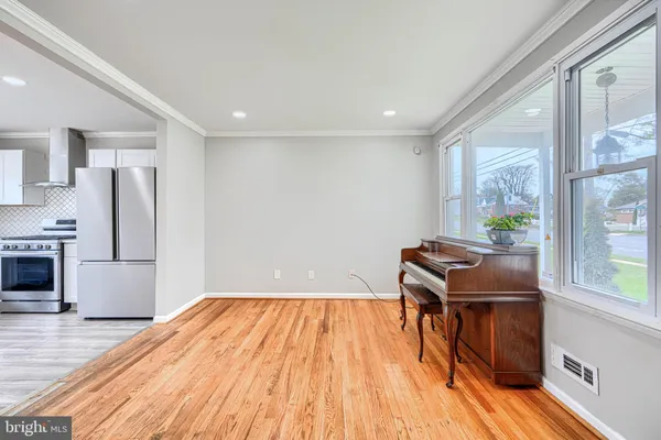 a room with wooden floors and furniture