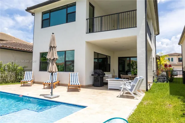 an aerial view of a house with outdoor space
