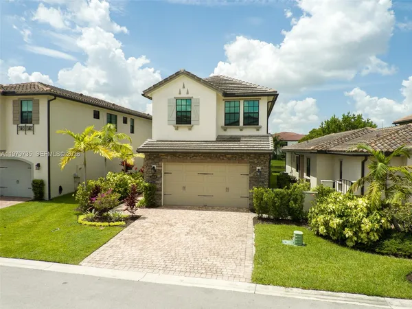an aerial view of house with yard swimming pool and outdoor seating