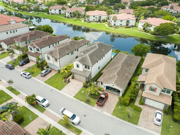 an aerial view of residential houses with outdoor space