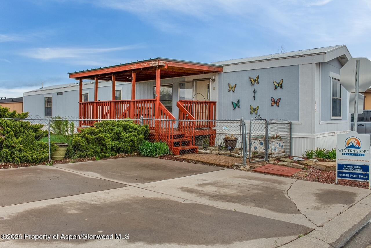 a front view of building with cars