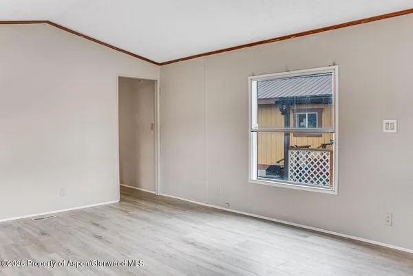 a view of an empty room with windows