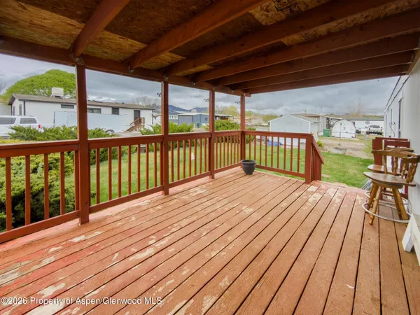 a view of balcony with wooden floor