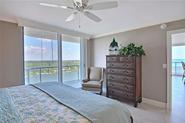 a spacious bedroom with a large bed and a window