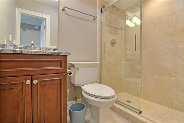 a bathroom with a toilet a sink and shower