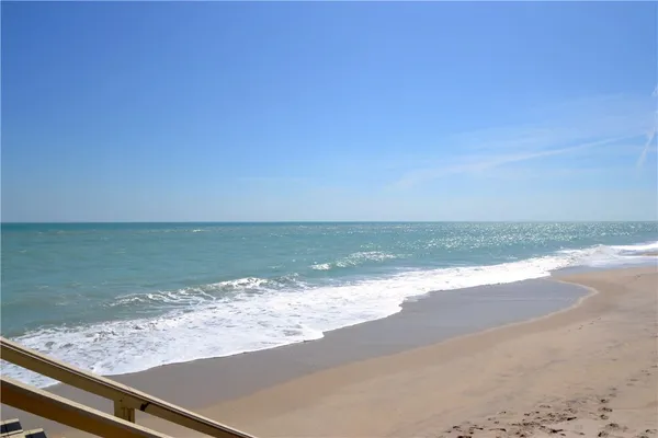 a view of a swimming pool with chairs