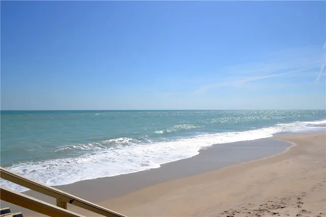 a view of a swimming pool with chairs