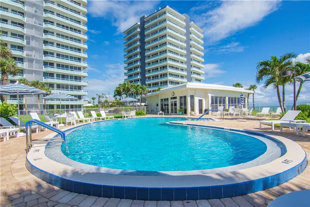 a view of a swimming pool with a patio