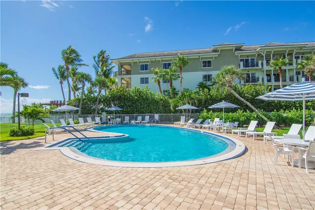 a view of a swimming pool with a lounge chair