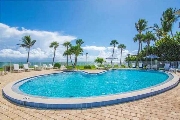a view of a swimming pool with a patio