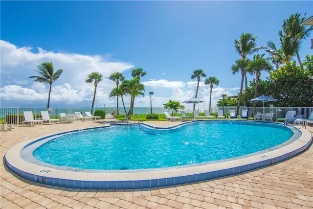 a view of a swimming pool with a patio