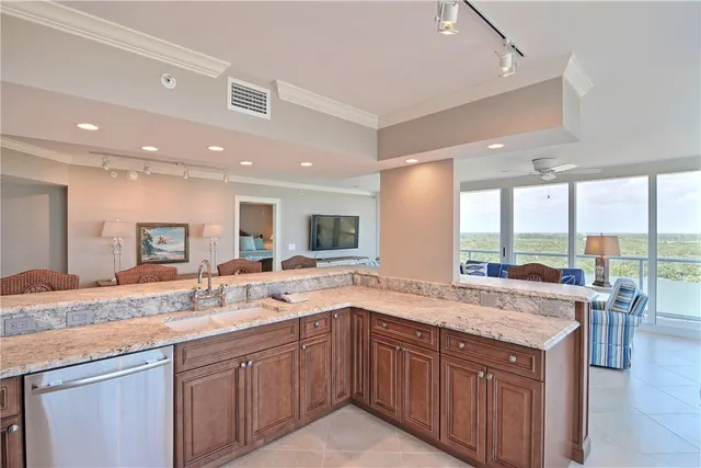 a kitchen with a sink and a large window