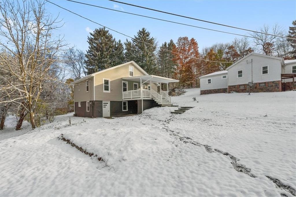 111 Becker Road Butler, PA 16002 - Photo 21 of 25 a view of a house with a yard covered in snow