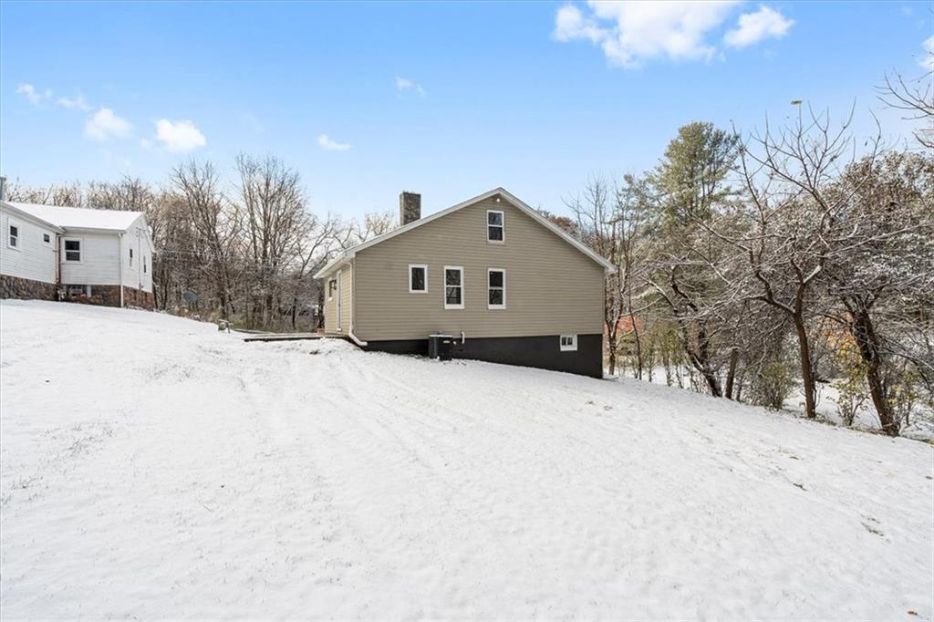 111 Becker Road Butler, PA 16002 - Photo 23 of 25 a front view of a house with a yard covered in snow