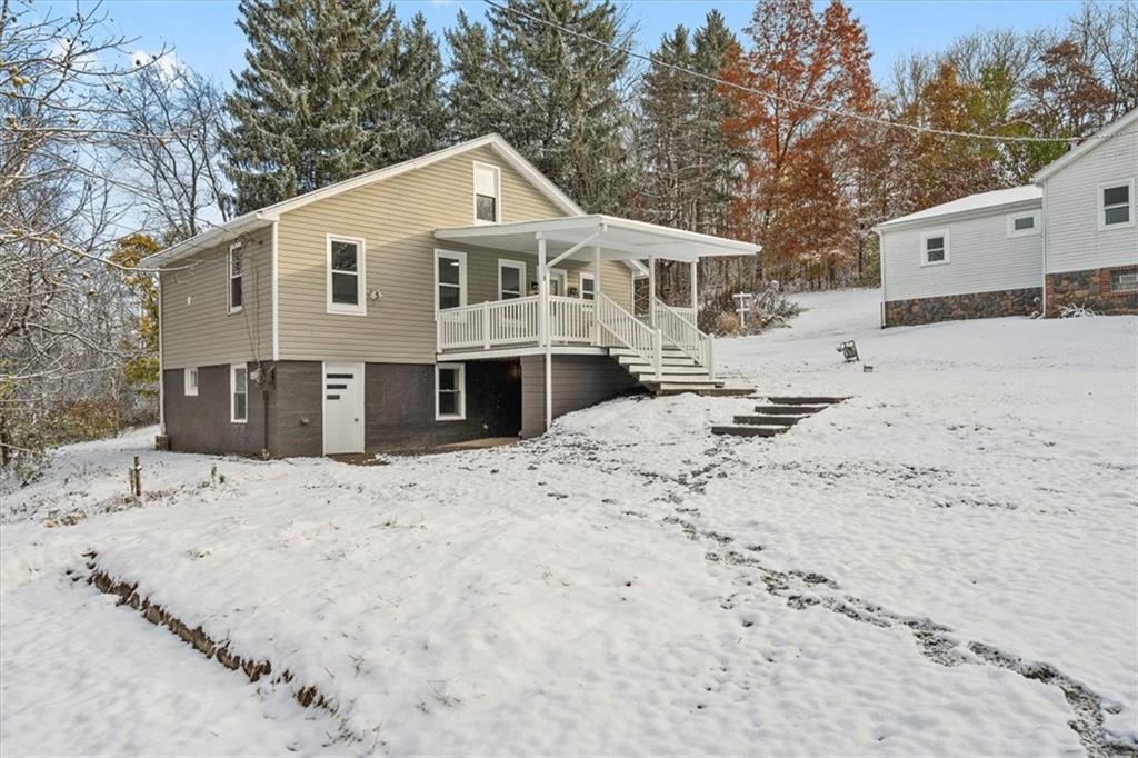 111 Becker Road Butler, PA 16002 - Photo 25 of 25 a front view of a house with a yard covered with snow