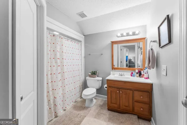 a view of house with outdoor space and street view