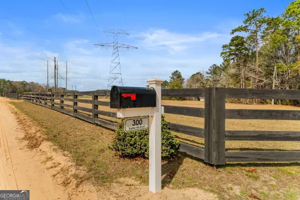 a view of entryway livingroom and hall with wooden floor