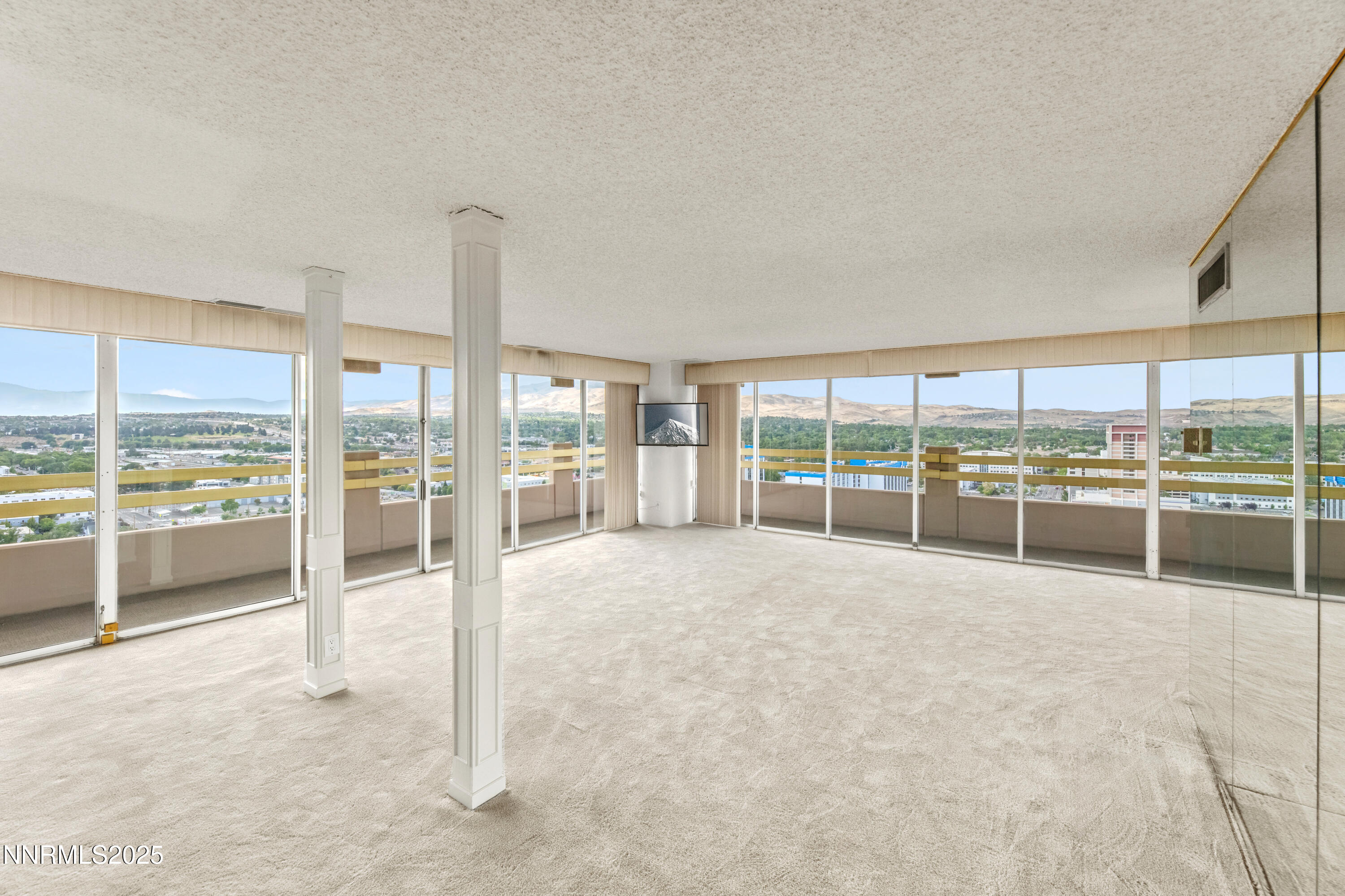 100 North Arlington Avenue, Unit 23P Reno, NV 89501 - Photo 2 of 31 a room with natural light