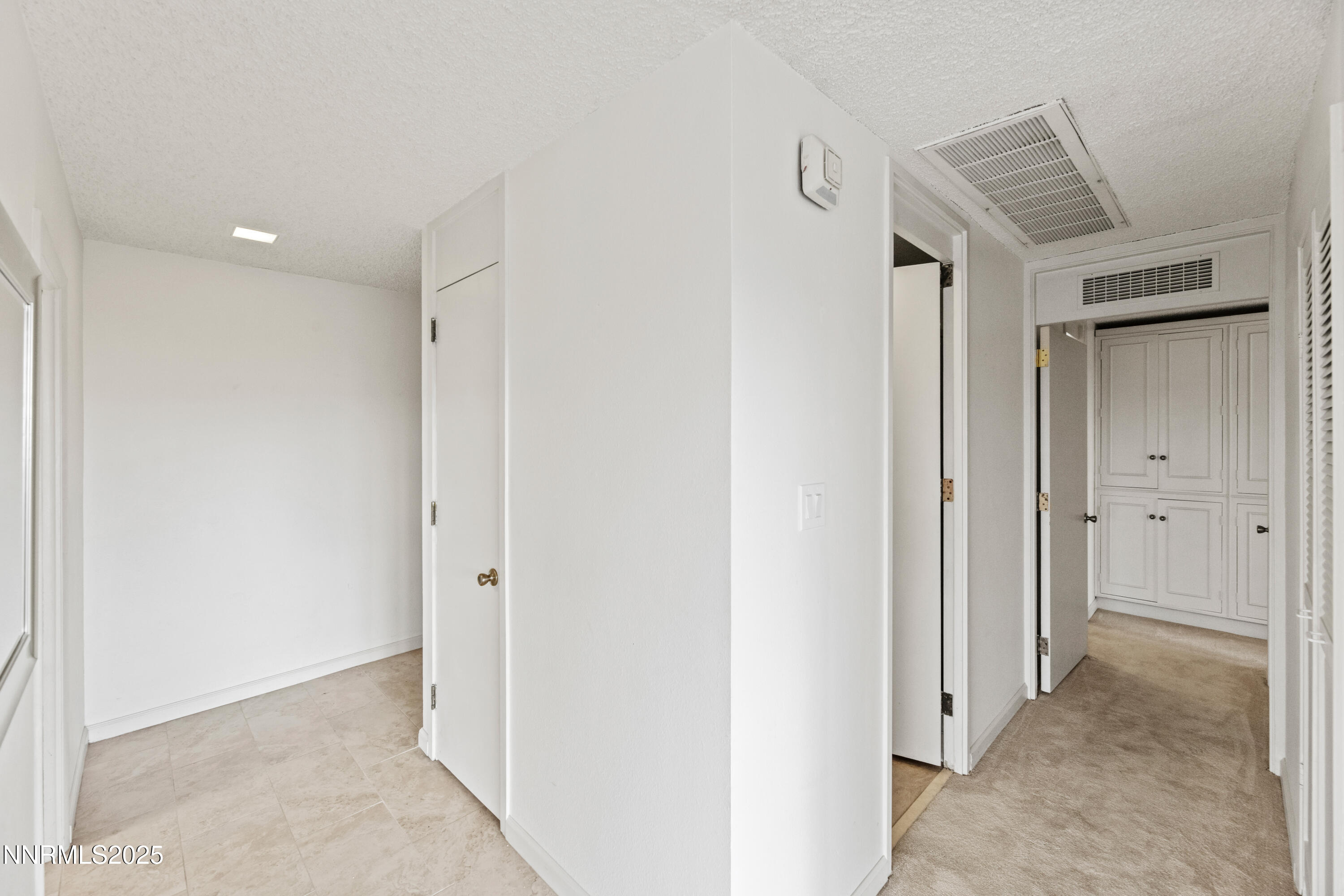 100 North Arlington Avenue, Unit 23P Reno, NV 89501 - Photo 10 of 31 a view of a hallway to closet and wooden floor