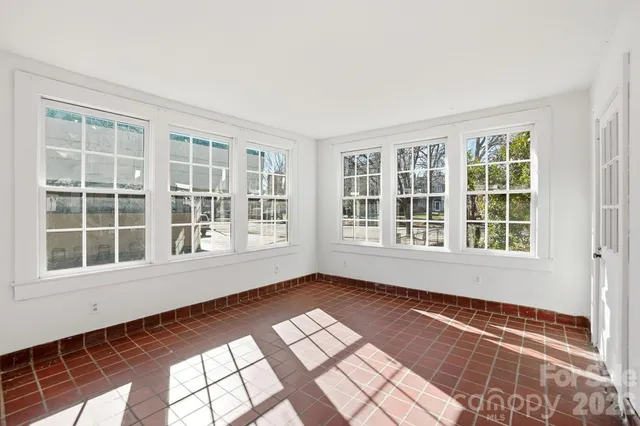 a view of empty room with windows