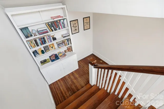 a view of an empty room with stairs