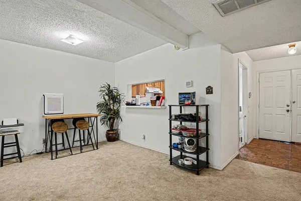 a view of a livingroom with furniture and toys
