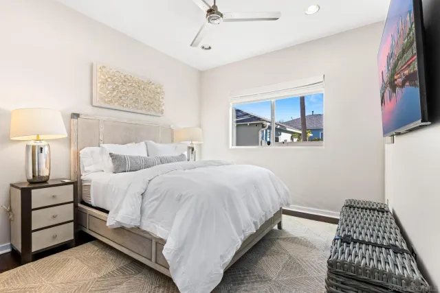 a bed room with a bed and a night stand