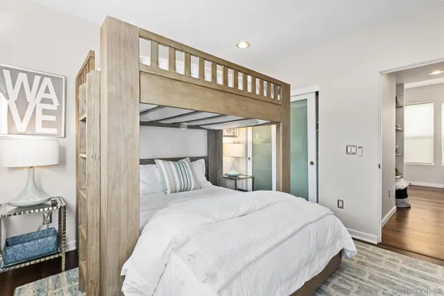 a bedroom with a bed and a view of bedroom