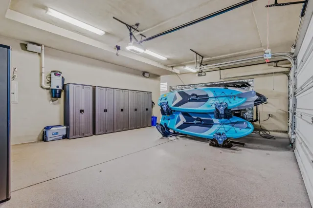 an aerial view of houses with trees