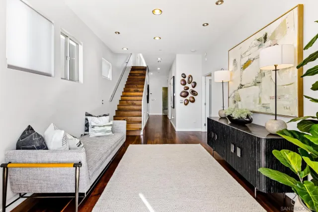a bed room with wooden floor and furniture