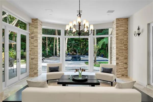 a view of an chairs and table in the patio