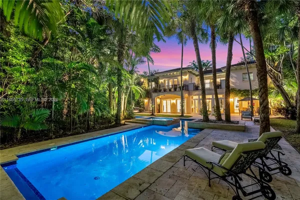 a view of swimming pool with outdoor seating