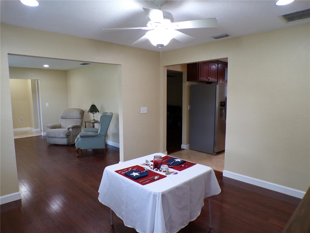 4131 Yorketowne Road Orlando, FL 32812 - Photo 15 of 53 Formal Dining Room looking into the Formal Living Room and to the right the Kitchen.