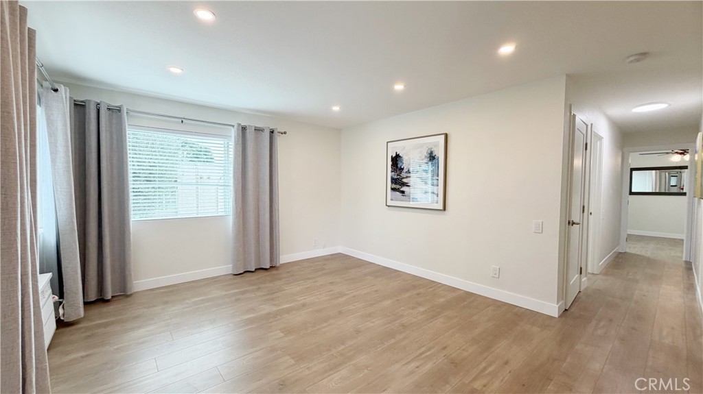 212 South Kraemer, Unit 2208 Placentia, CA 92870 - Photo 5 of 16 an empty room with wooden floor and windows