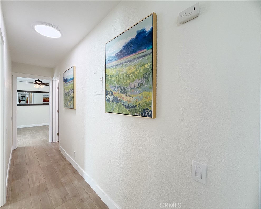 212 South Kraemer, Unit 2208 Placentia, CA 92870 - Photo 10 of 16 a view of a hallway with wooden floor and a living room