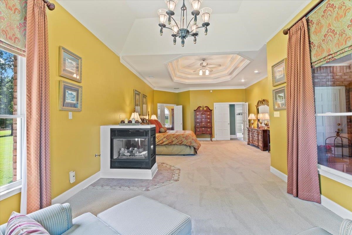 1226 Oak Lake Circle Collierville, TN 38017 - Photo 20 of 39 a bedroom with a bed and dresser with mirror