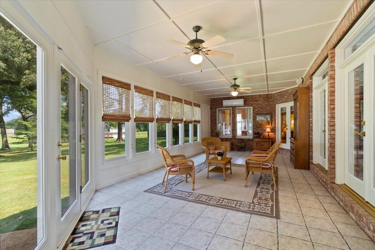 1226 Oak Lake Circle Collierville, TN 38017 - Photo 26 of 39 a living room with patio furniture and a floor to ceiling window