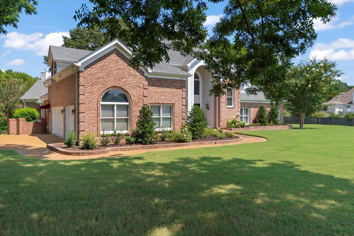 1226 Oak Lake Circle Collierville, TN 38017 - Photo 3 of 39 a front view of a house with a yard
