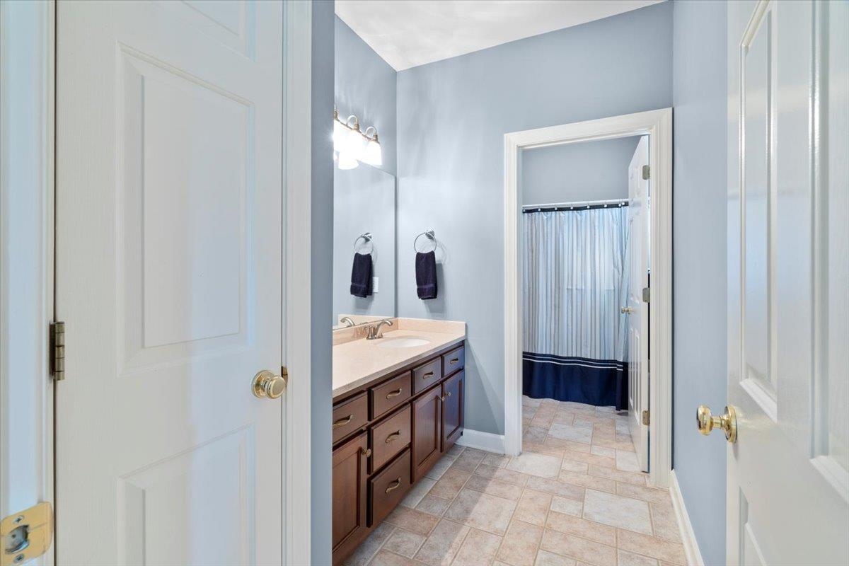 1226 Oak Lake Circle Collierville, TN 38017 - Photo 31 of 39 a bathroom with a tub and a sink