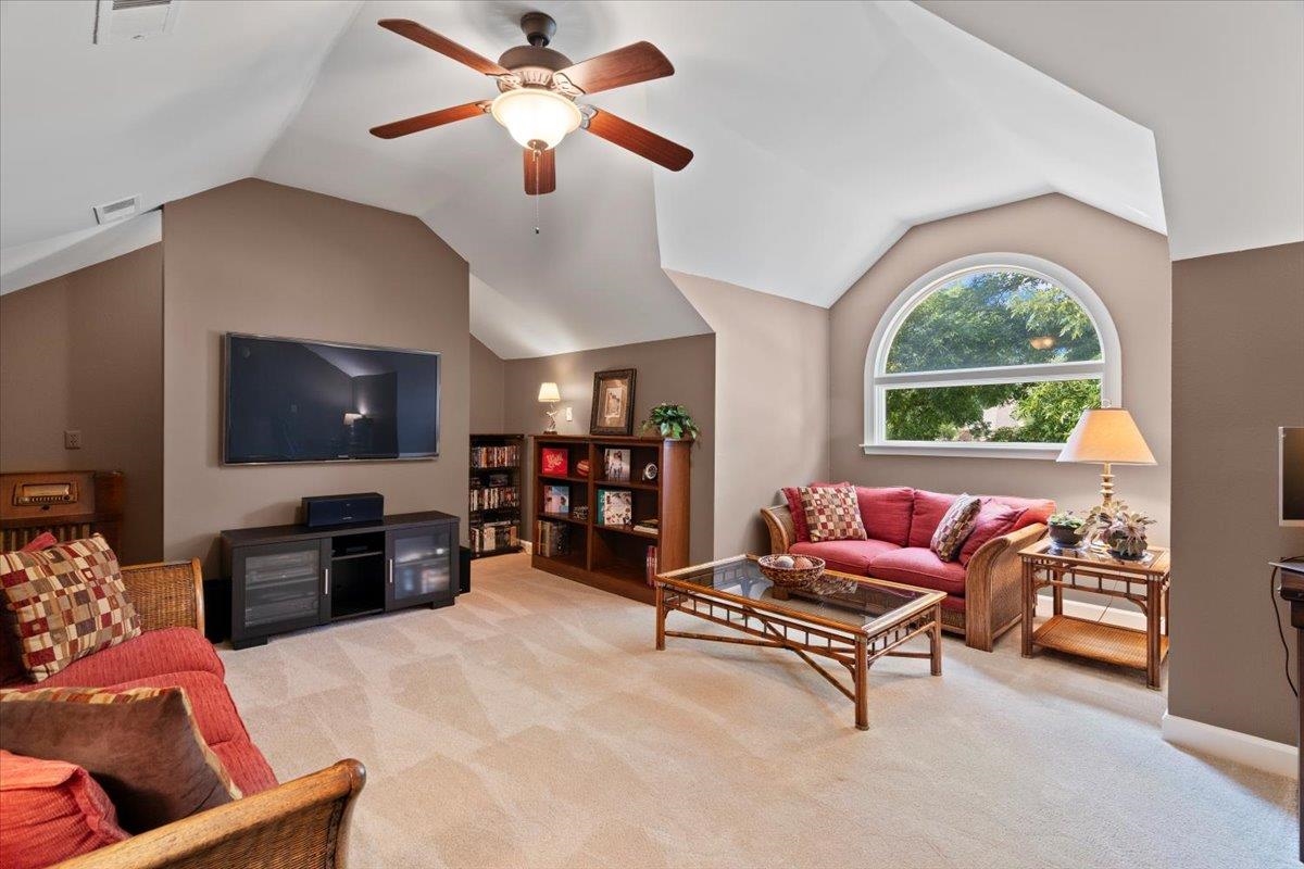 1226 Oak Lake Circle Collierville, TN 38017 - Photo 35 of 39 a living room with furniture a flat screen tv and a window