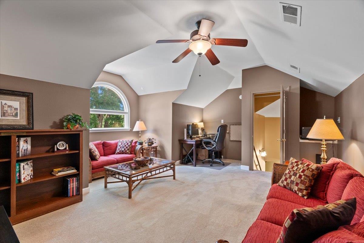 1226 Oak Lake Circle Collierville, TN 38017 - Photo 36 of 39 a living room with furniture a rug and a chandelier